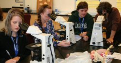 BrainU Winona participants working with microscopes